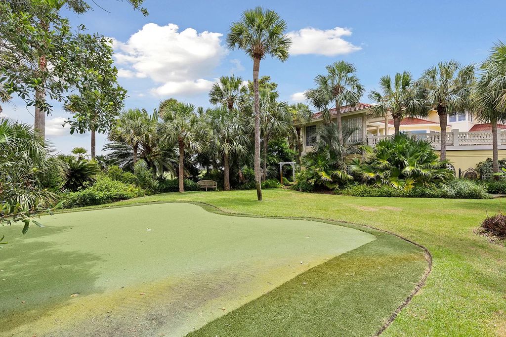 The Retreat in Isle Of Palms offers a spacious interior, inviting outdoor living spaces and mature landscaping, now available for sale. This home located at 61 Ocean Poin, Isle Of Palms, South Carolina