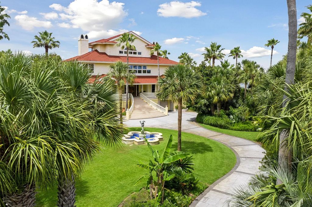 The Retreat in Isle Of Palms offers a spacious interior, inviting outdoor living spaces and mature landscaping, now available for sale. This home located at 61 Ocean Poin, Isle Of Palms, South Carolina