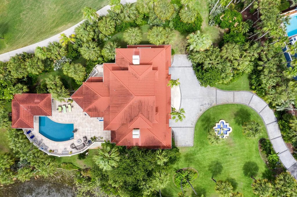 The Retreat in Isle Of Palms offers a spacious interior, inviting outdoor living spaces and mature landscaping, now available for sale. This home located at 61 Ocean Poin, Isle Of Palms, South Carolina