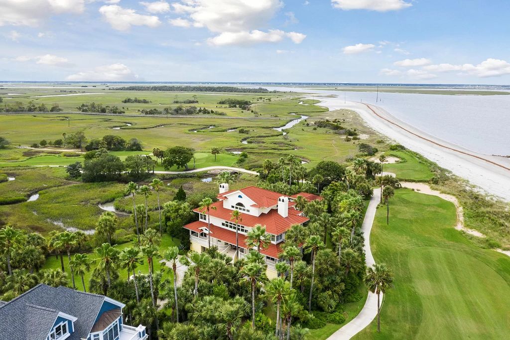 The Retreat in Isle Of Palms offers a spacious interior, inviting outdoor living spaces and mature landscaping, now available for sale. This home located at 61 Ocean Poin, Isle Of Palms, South Carolina