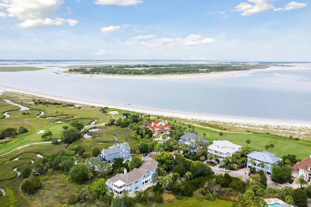 The Retreat in Isle Of Palms offers a spacious interior, inviting outdoor living spaces and mature landscaping, now available for sale. This home located at 61 Ocean Poin, Isle Of Palms, South Carolina