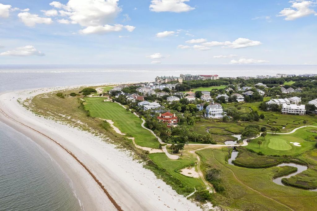 The Retreat in Isle Of Palms offers a spacious interior, inviting outdoor living spaces and mature landscaping, now available for sale. This home located at 61 Ocean Poin, Isle Of Palms, South Carolina