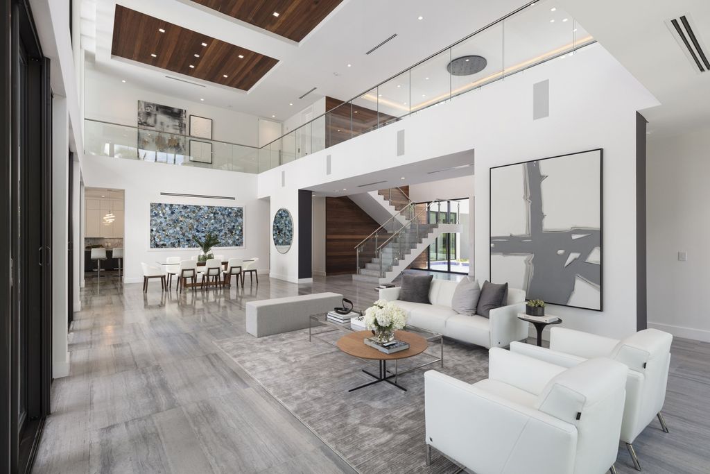 The Home in Pinecrest, a newly completed estate features smart home technology, high end finishes, home theater, elevator, large den, two driveways and thoughtful extras. This home located at 6155 SW 106th St, Pinecrest, Florida.