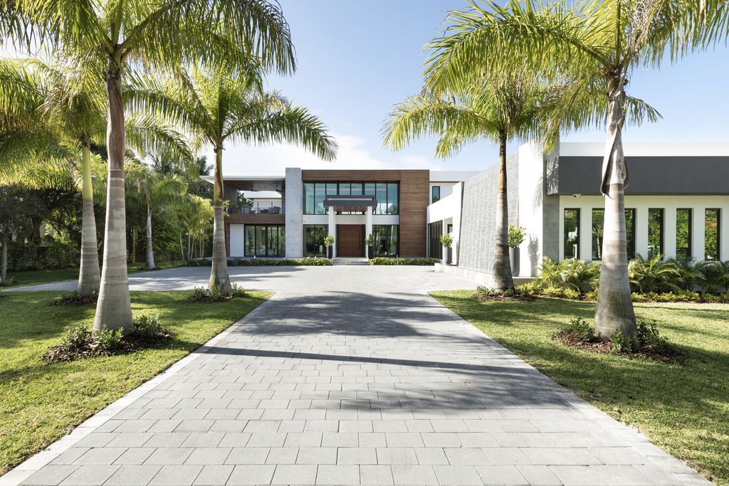 The Home in Pinecrest, a newly completed estate features smart home technology, high end finishes, home theater, elevator, large den, two driveways and thoughtful extras. This home located at 6155 SW 106th St, Pinecrest, Florida.