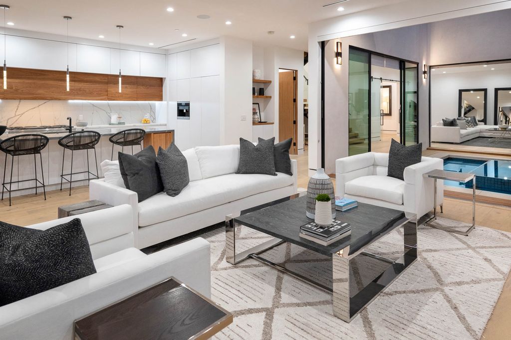 The Home in Venice is a newer construction home features an open floor plan, high ceilings and oversized windows that create a bright crisp ambiance now available for sale. This home located at 2319 Penmar Ave, Venice, California