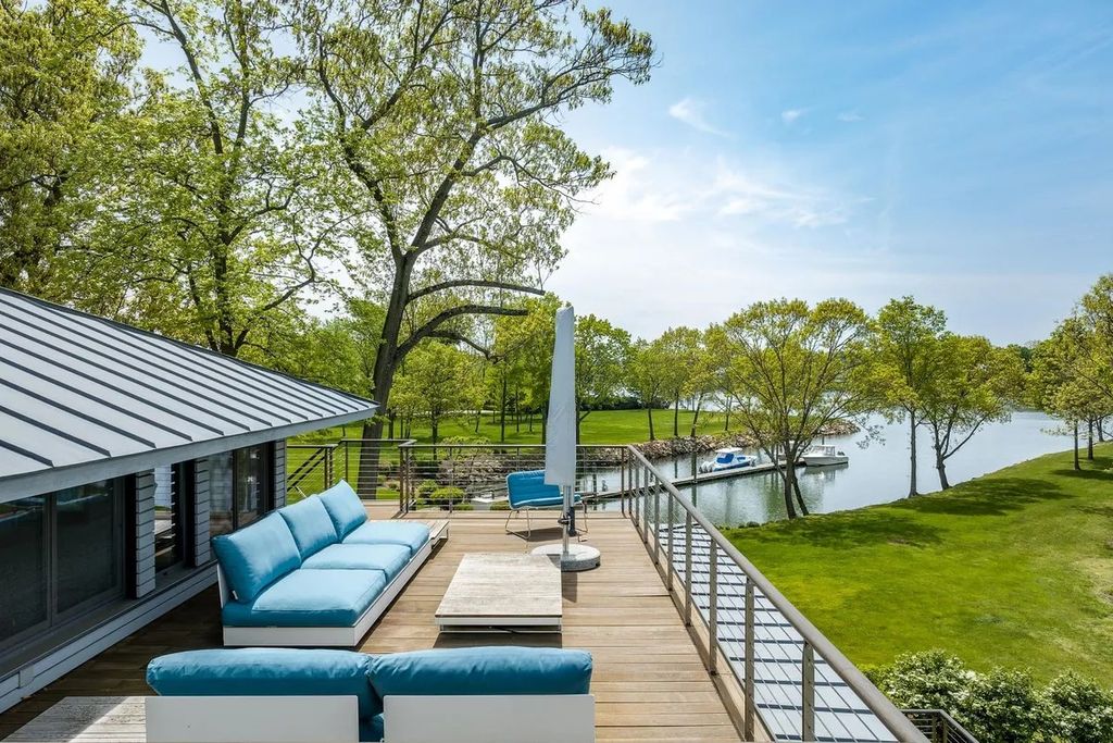 The Home in Greenwich is nestled alongside a private 5-acre park with a 160' deep-water dock, now available for sale. This home located at 6 Windrose Way, Greenwich, Connecticut