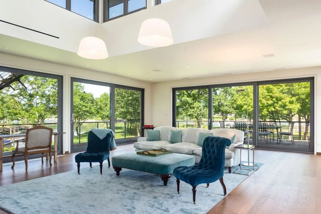 The Home in Greenwich is nestled alongside a private 5-acre park with a 160' deep-water dock, now available for sale. This home located at 6 Windrose Way, Greenwich, Connecticut