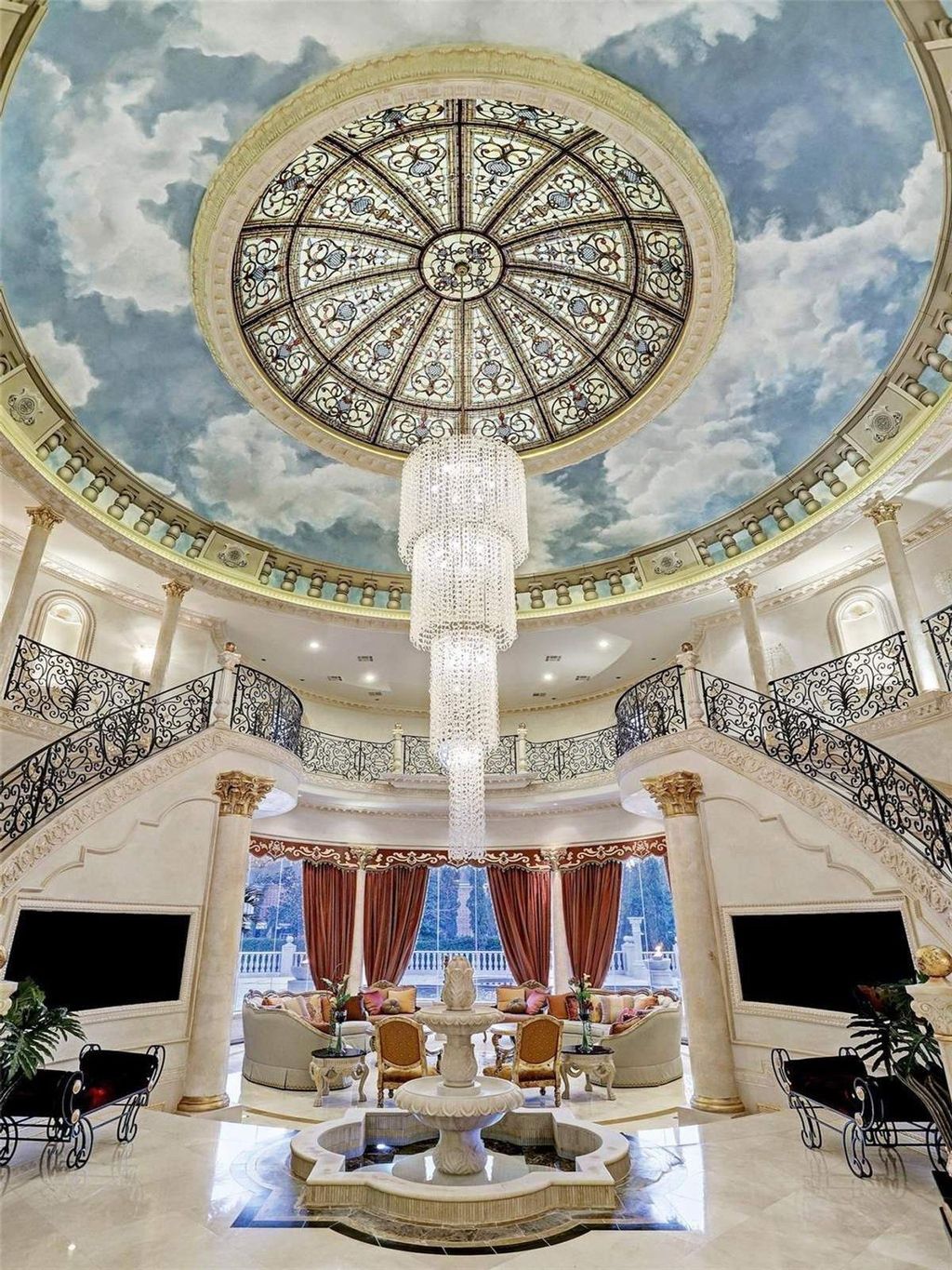 The Residence in Sugar Land, a exquisite palatial style estate constructed with many detailed and intricate moldings, marble floors, Venetian plaster walls, custom cabinetry and ornate finishes, gold leaf accents, and crystal chandeliers. This home located at 5324 Palm Royale Blvd, Sugar Land, Texas