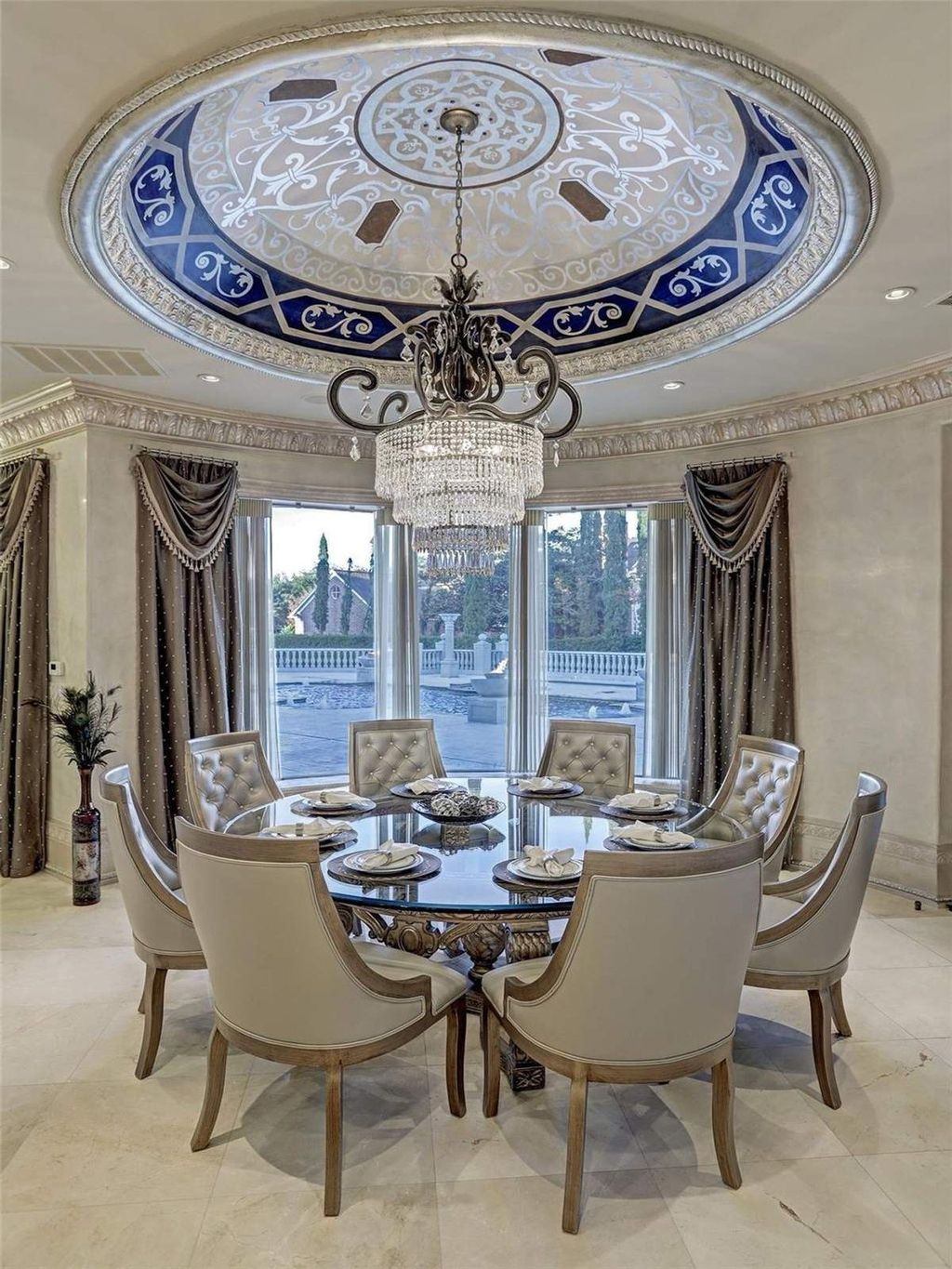 The Residence in Sugar Land, a exquisite palatial style estate constructed with many detailed and intricate moldings, marble floors, Venetian plaster walls, custom cabinetry and ornate finishes, gold leaf accents, and crystal chandeliers. This home located at 5324 Palm Royale Blvd, Sugar Land, Texas