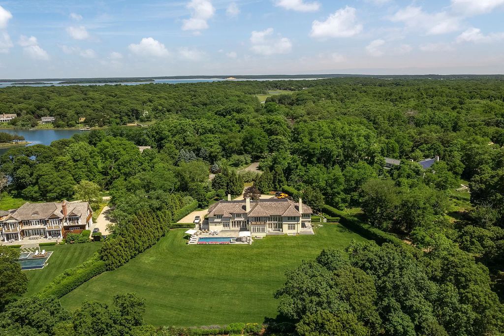 The Home in Sag Harbor, a gated residence set on a truly unique and special location with over 400 feet of direct waterfront and multiple entertaining spaces is now available for sale. This home located at 35 Ezekills Holw, Sag Harbor, New York