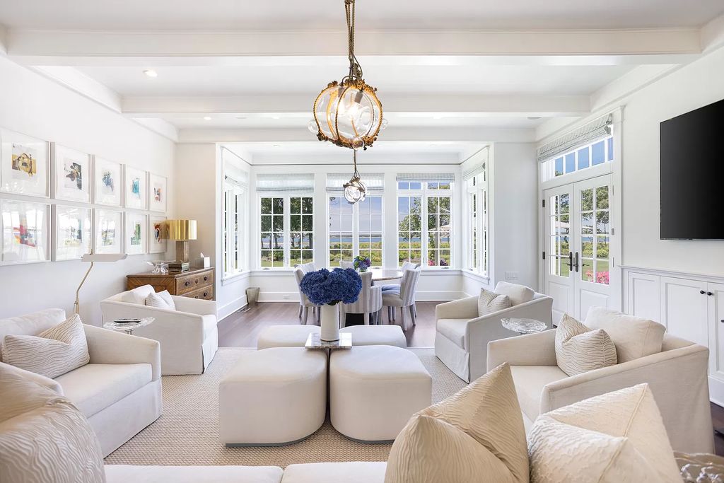 The Home in Sag Harbor, a gated residence set on a truly unique and special location with over 400 feet of direct waterfront and multiple entertaining spaces is now available for sale. This home located at 35 Ezekills Holw, Sag Harbor, New York