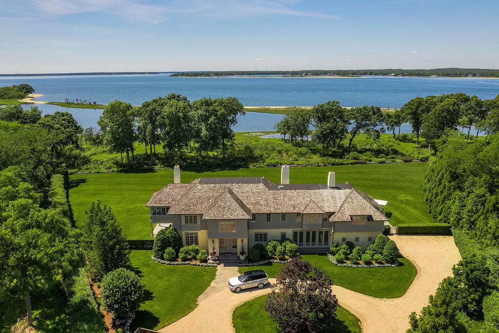 The Home in Sag Harbor, a gated residence set on a truly unique and special location with over 400 feet of direct waterfront and multiple entertaining spaces is now available for sale. This home located at 35 Ezekills Holw, Sag Harbor, New York