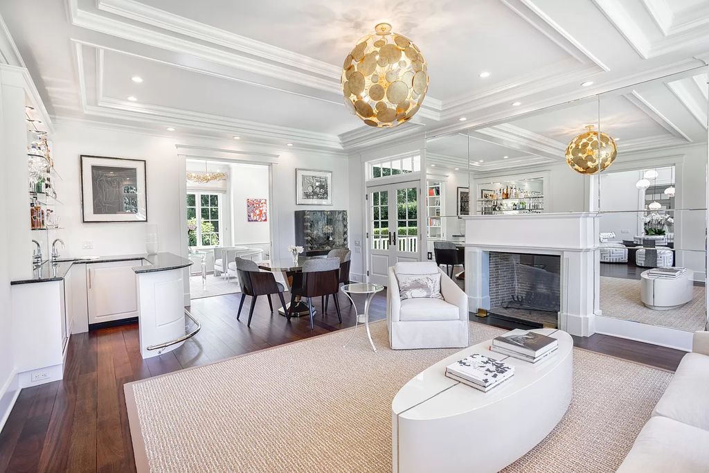 The Home in Sag Harbor, a gated residence set on a truly unique and special location with over 400 feet of direct waterfront and multiple entertaining spaces is now available for sale. This home located at 35 Ezekills Holw, Sag Harbor, New York