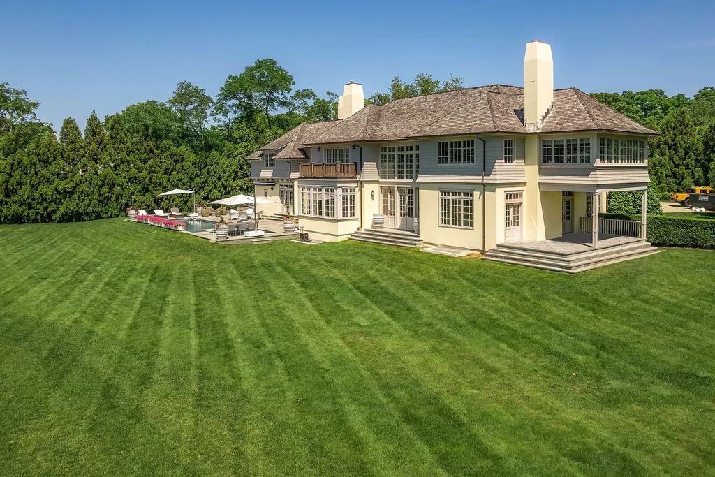 The Home in Sag Harbor, a gated residence set on a truly unique and special location with over 400 feet of direct waterfront and multiple entertaining spaces is now available for sale. This home located at 35 Ezekills Holw, Sag Harbor, New York