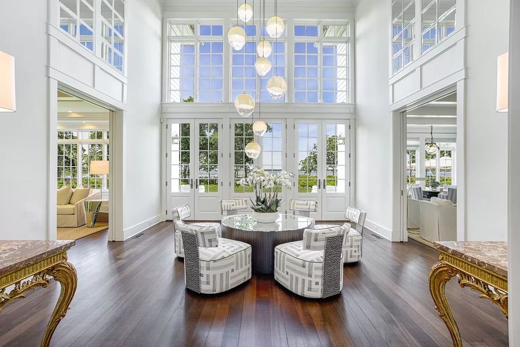 The Home in Sag Harbor, a gated residence set on a truly unique and special location with over 400 feet of direct waterfront and multiple entertaining spaces is now available for sale. This home located at 35 Ezekills Holw, Sag Harbor, New York