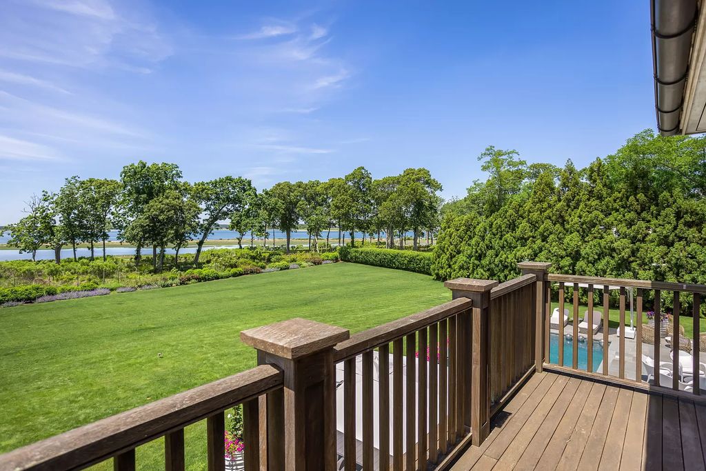 The Home in Sag Harbor, a gated residence set on a truly unique and special location with over 400 feet of direct waterfront and multiple entertaining spaces is now available for sale. This home located at 35 Ezekills Holw, Sag Harbor, New York