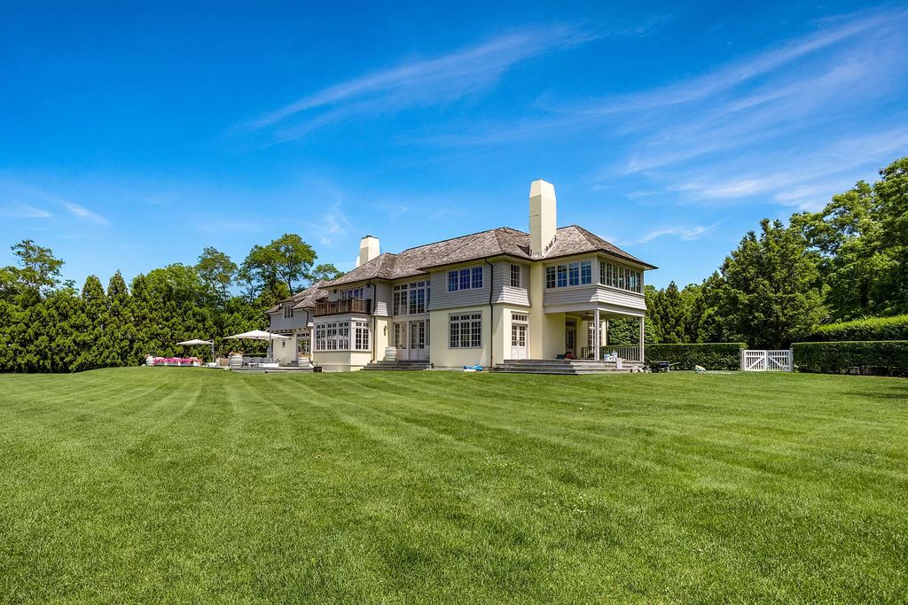 The Home in Sag Harbor, a gated residence set on a truly unique and special location with over 400 feet of direct waterfront and multiple entertaining spaces is now available for sale. This home located at 35 Ezekills Holw, Sag Harbor, New York