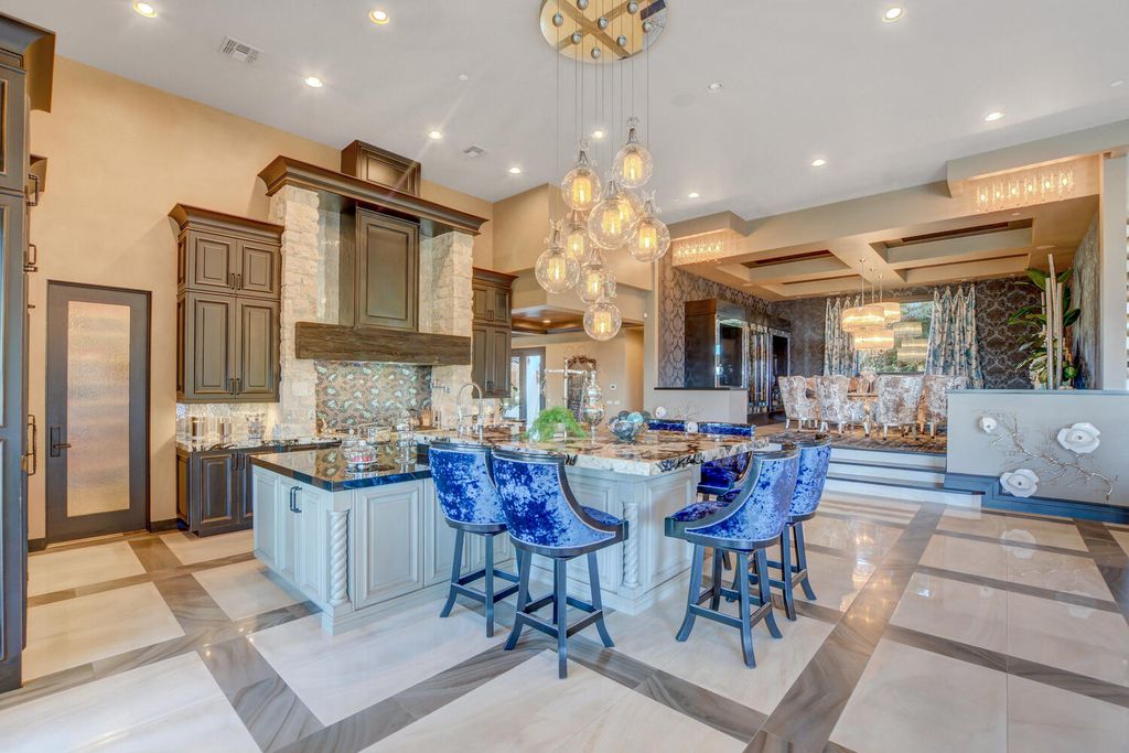 The Home in Henderson, a one of a kind estate has a jaw dropping resort style backyard with stunning 180 degree views of the Vegas Strip and the entire Vegas Valley. This home located at 677 Boulder Summit Dr, Henderson, Nevada.