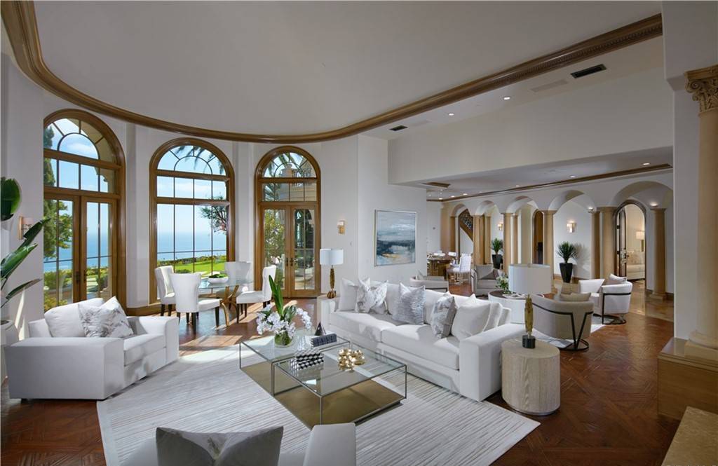 The Villa in Newport Coast is a Pelican Crest showpiece estate was just refreshed in 2022 and enjoys unobstructed views of the Pacific Ocean now available for sale. This home located at 14 Channel Vis, Newport Coast, California