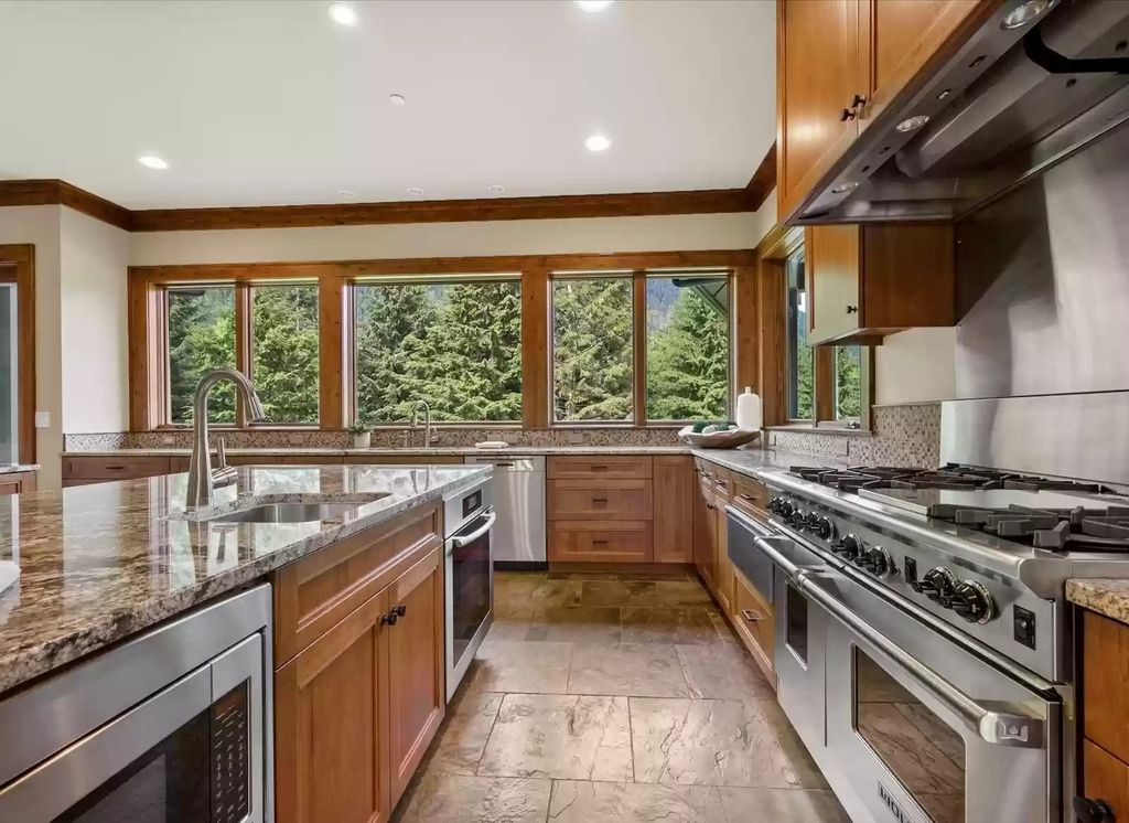 The Estate in Washington is a luxurious home greeting you with soaring ceilings, dramatic windows and unrivaled views now available for sale. This home located at 15623 Uplands Way SE, North Bend, Washington; offering 04 bedrooms and 05 bathrooms with 6,300 square feet of living spaces. 