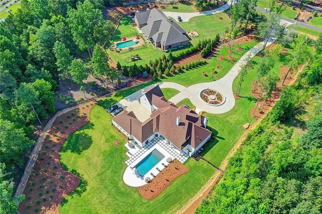 The Estate in Georgia is a luxurious home where you will find beautifully sculpted landscape, gorgeous vaulted ceilings, chef’s kitchen with top-of-the-line appliances and other incredible features now available for sale. This home located at 2242 Shoal Creek Rd, Buford, Georgia; offering 06 bedrooms and 08 bathrooms with 7,500 square feet of living spaces. 