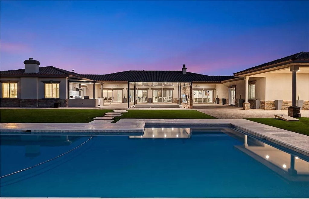 The Home in Las Vegas, a spectacular estate with the vibe and design featuring new luxurious and modern finishes throughout, and a stunning backyard. This home located at 9116 Hickam Ave, Las Vegas, Nevada.