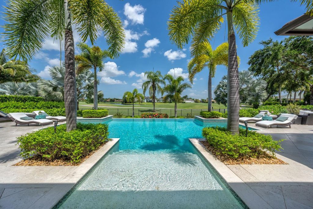 The Home in Naples is a jaw-dropping residence features an open family room with custom built-ins and architectural ceilings now available for sale. This home located at 13901 Williston Way, Naples, Florida
