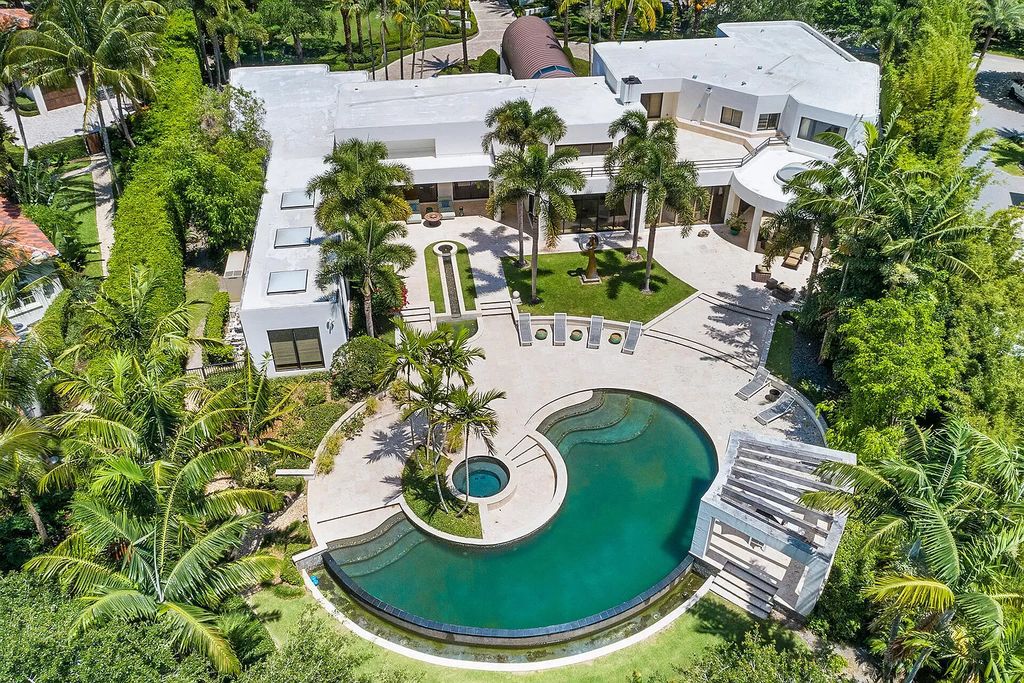 The Home in Boca Raton, a beautiful contemporary estate was tastefully reconstructed, offers extreme privacy surrounded by lush tropical palm trees  is now available for sale. This home located at 18211 Long Lake Dr, Boca Raton, Florida