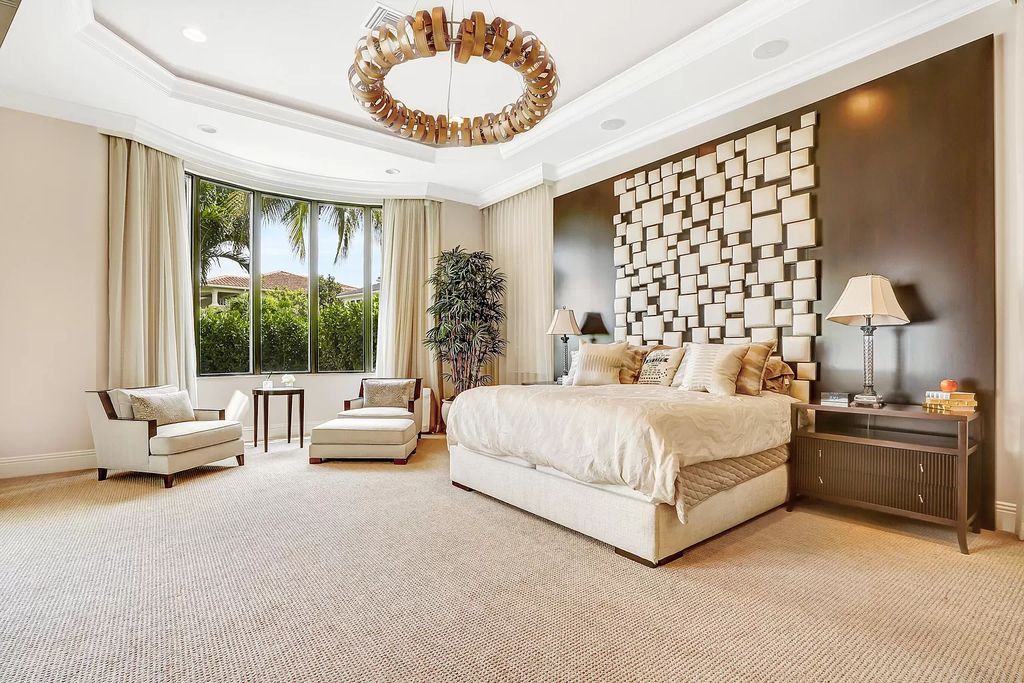 To us, this bedroom simply screams leisurely Sunday morning. The basic neutral bedding is not overly intricate or fussy, and its transparent drapes allow light to gently stream in, adding to the room's peaceful atmosphere.