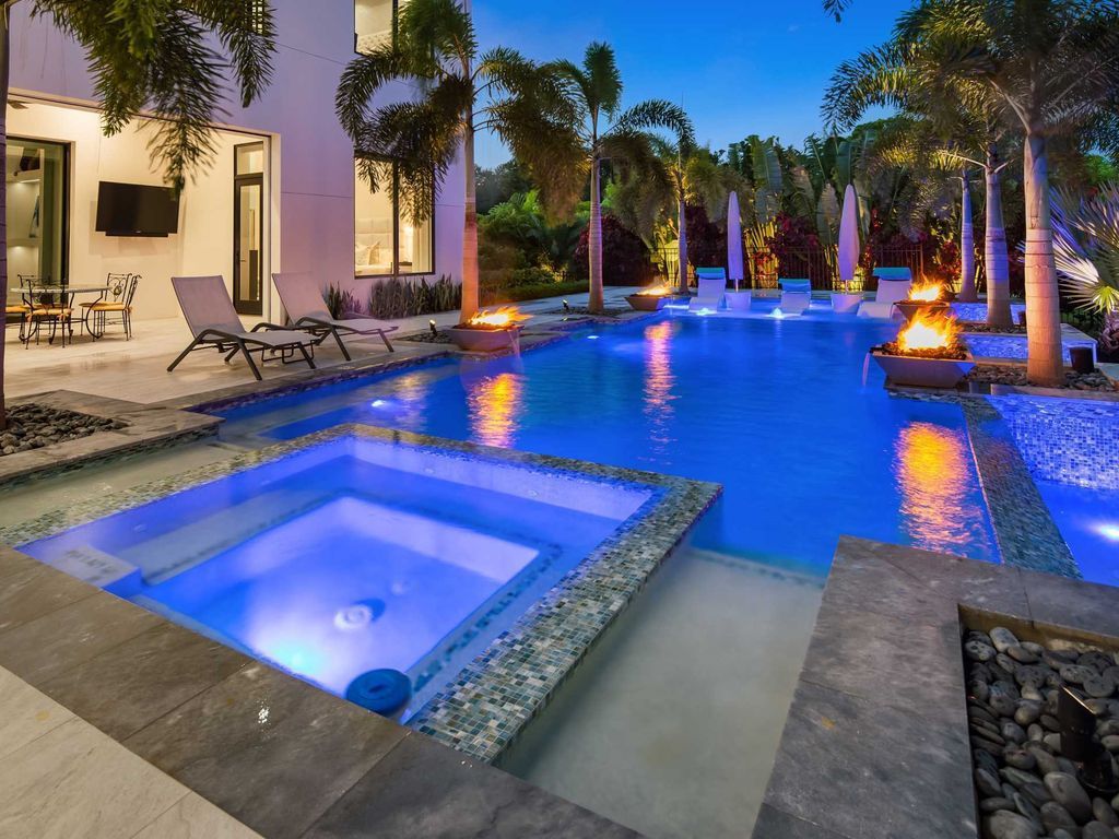 The Home in Naples is a luxurious home residence offers plenty of features with Central Vac, Lutron shading throughout, custom drapery, and smart home technology now available for sale. This home located at 882 Cassena Rd, Naples, Florida