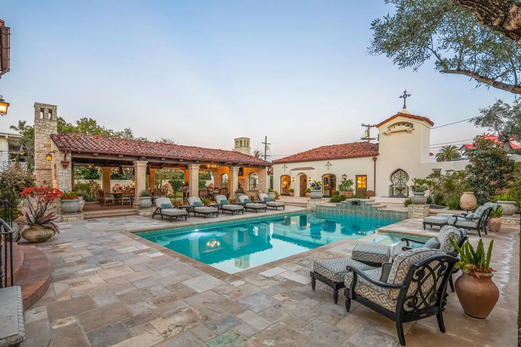 The Estate in Coronado, a historical landmark sits on a palm-lined promenade offering state-of-the-art amenities for optimal luxury living space, 100-year-old rustic olive trees, three fountains, a putting green, secret garden is now available for sale. This home located at 1127 F Ave, Coronado, California