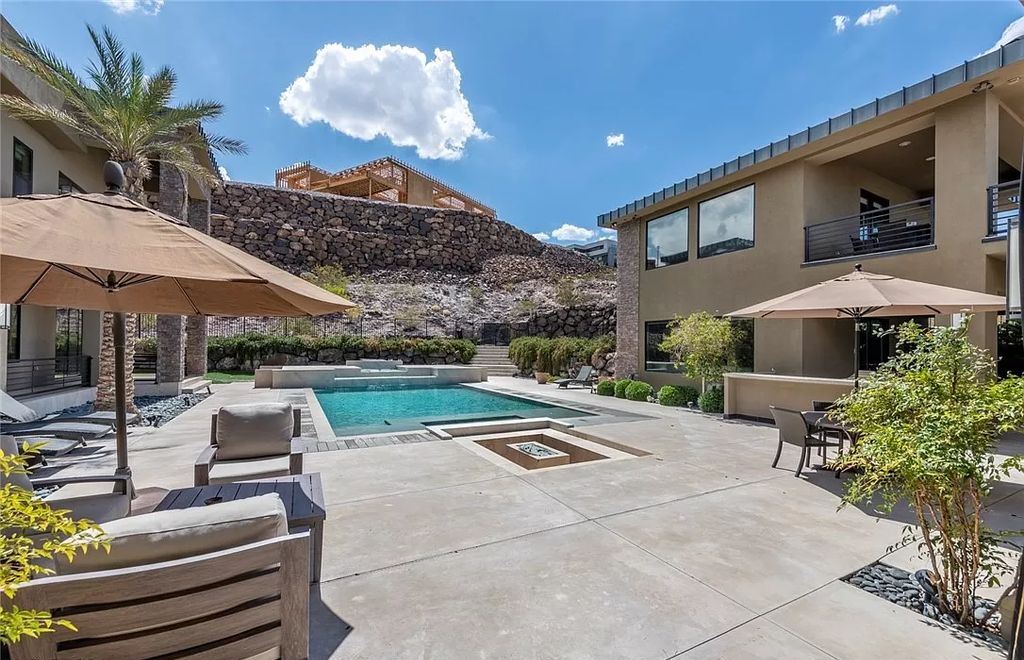 The Home in Henderson, a luxurious custom estate located inside prestigious McDonald’s Highlands with stunning entertainers delight backyard is now available for sale. This home located at 1465 Macdonald Ranch Dr, Henderson, Nevada