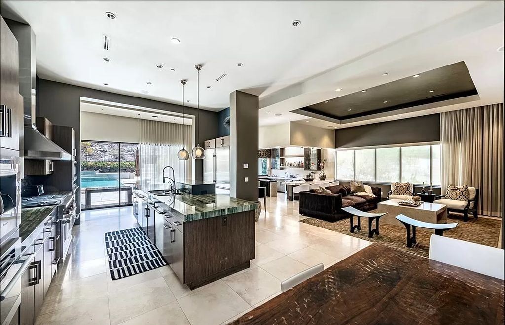 The Home in Henderson, a luxurious custom estate located inside prestigious McDonald’s Highlands with stunning entertainers delight backyard is now available for sale. This home located at 1465 Macdonald Ranch Dr, Henderson, Nevada