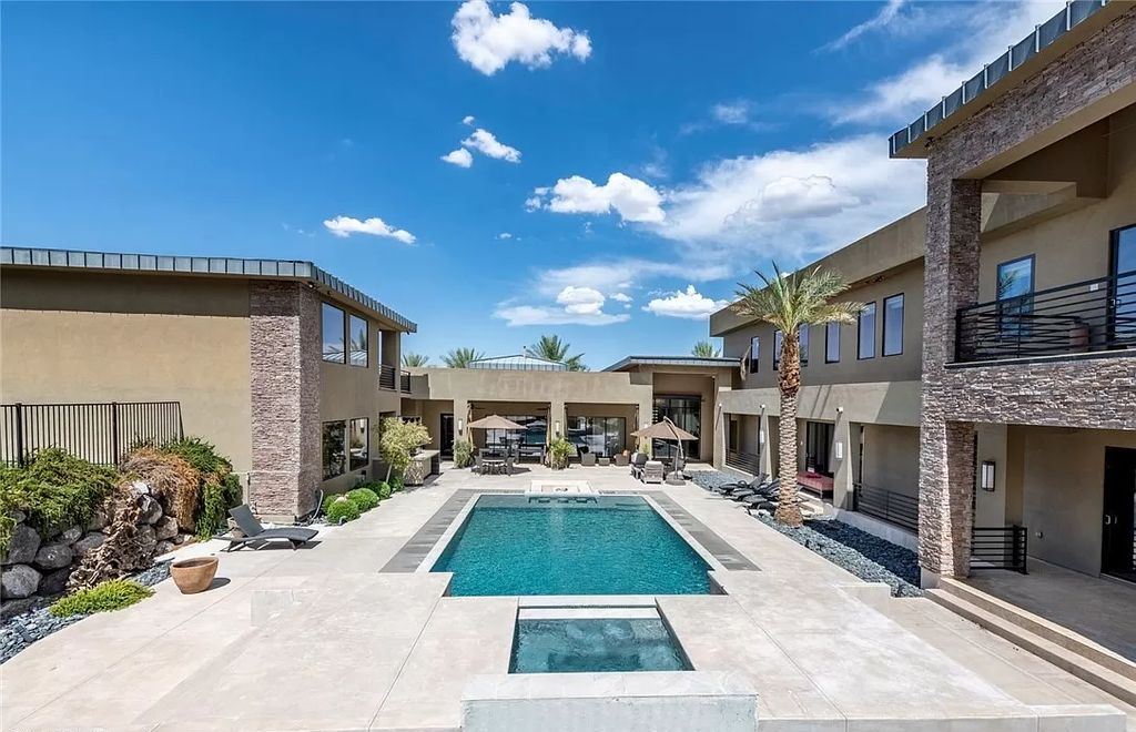 The Home in Henderson, a luxurious custom estate located inside prestigious McDonald’s Highlands with stunning entertainers delight backyard is now available for sale. This home located at 1465 Macdonald Ranch Dr, Henderson, Nevada