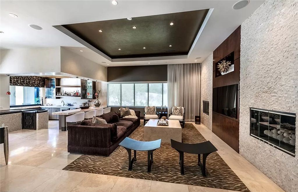 The Home in Henderson, a luxurious custom estate located inside prestigious McDonald’s Highlands with stunning entertainers delight backyard is now available for sale. This home located at 1465 Macdonald Ranch Dr, Henderson, Nevada