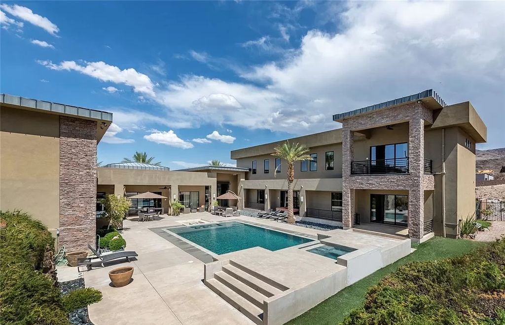 The Home in Henderson, a luxurious custom estate located inside prestigious McDonald’s Highlands with stunning entertainers delight backyard is now available for sale. This home located at 1465 Macdonald Ranch Dr, Henderson, Nevada