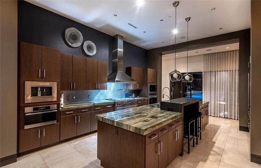 The Home in Henderson, a luxurious custom estate located inside prestigious McDonald’s Highlands with stunning entertainers delight backyard is now available for sale. This home located at 1465 Macdonald Ranch Dr, Henderson, Nevada