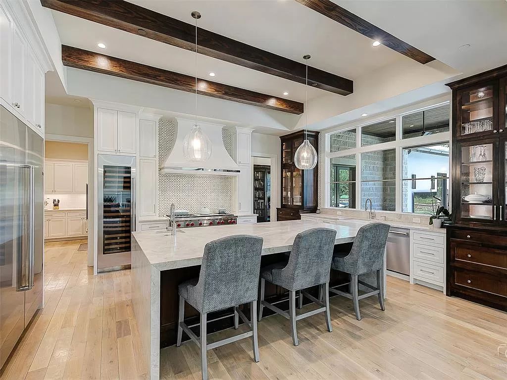 The Home in Westlake, a transitional style estate with clean lines, stunning steel, glass doors throughout, Ipe wood accents and spacious outdoor entertaining is now available for sale. This home located at 1714 Post Oak Pl, Westlake, Texas