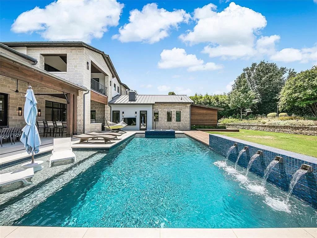 The Home in Westlake, a transitional style estate with clean lines, stunning steel, glass doors throughout, Ipe wood accents and spacious outdoor entertaining is now available for sale. This home located at 1714 Post Oak Pl, Westlake, Texas