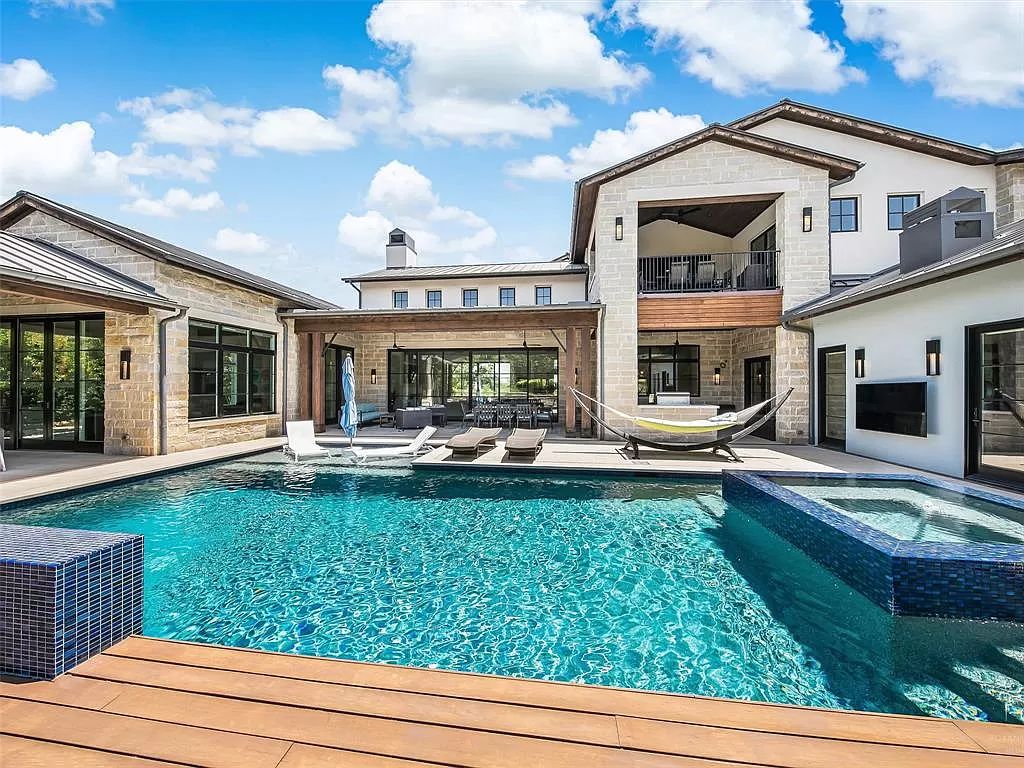 The Home in Westlake, a transitional style estate with clean lines, stunning steel, glass doors throughout, Ipe wood accents and spacious outdoor entertaining is now available for sale. This home located at 1714 Post Oak Pl, Westlake, Texas