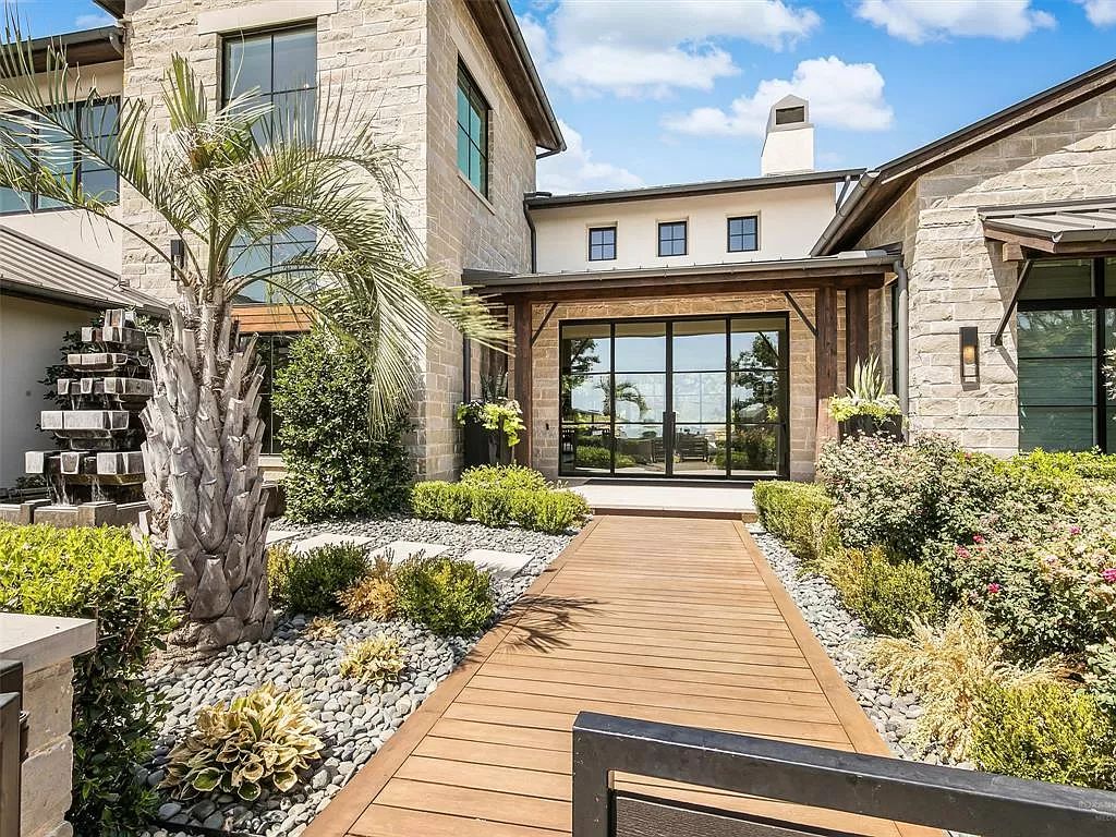 The Home in Westlake, a transitional style estate with clean lines, stunning steel, glass doors throughout, Ipe wood accents and spacious outdoor entertaining is now available for sale. This home located at 1714 Post Oak Pl, Westlake, Texas