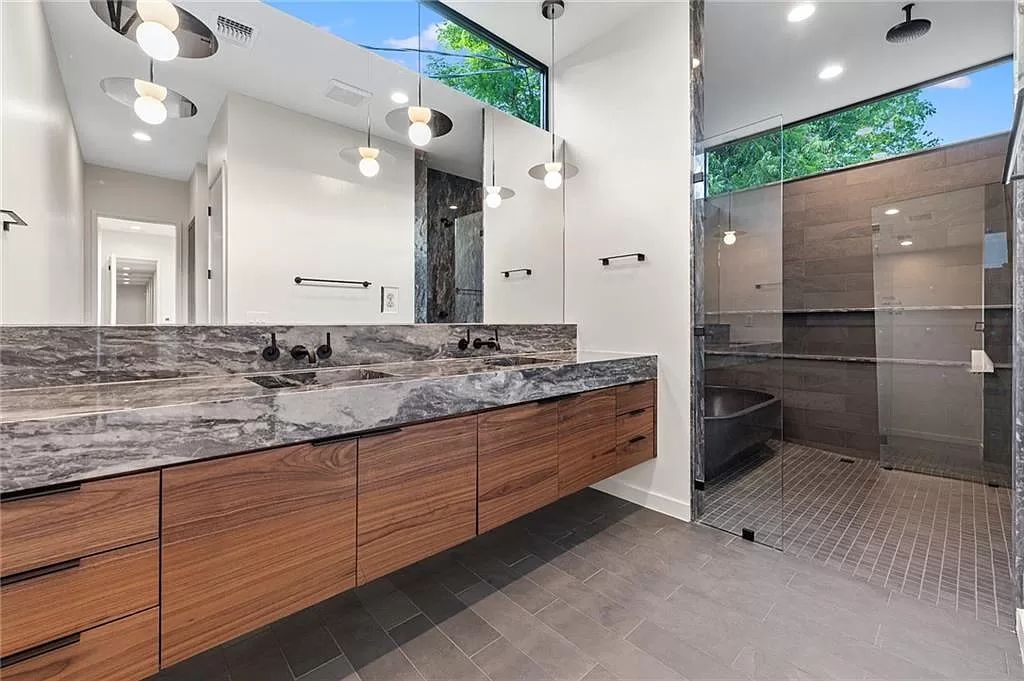 The Home in Austin, a new construction designed by Davey McEathron offers a wide open floor plan and floor-to-ceiling windows allowing for abundant natural light is now available for sale. This home located at 2104 Ann Arbor Ave, Austin, Texas