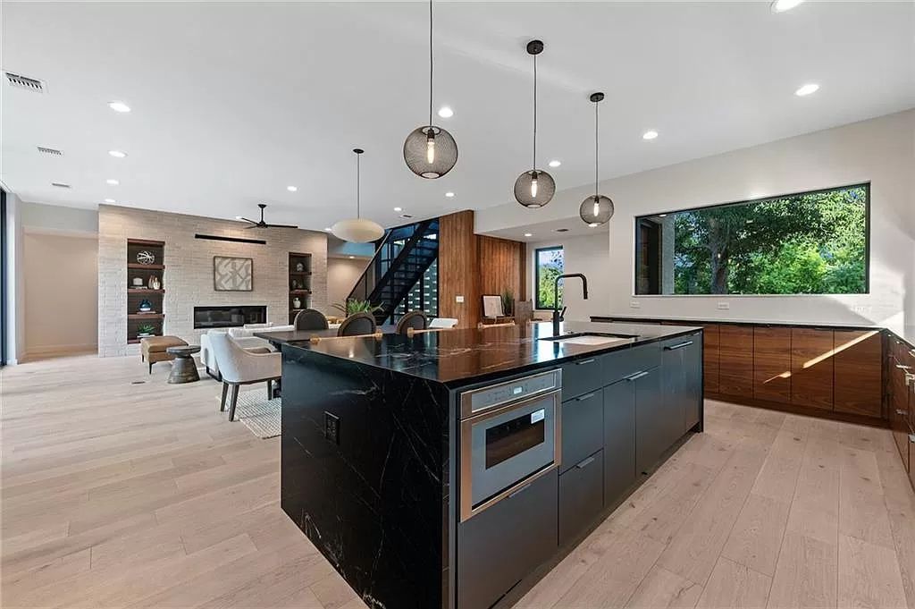 The Home in Austin, a new construction designed by Davey McEathron offers a wide open floor plan and floor-to-ceiling windows allowing for abundant natural light is now available for sale. This home located at 2104 Ann Arbor Ave, Austin, Texas