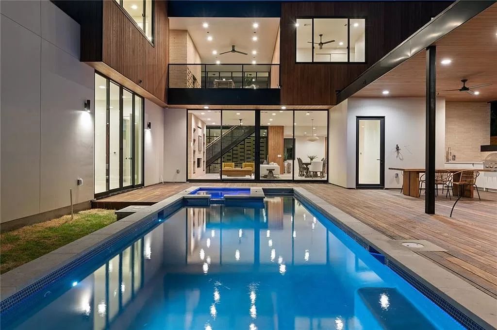 The Home in Austin, a new construction designed by Davey McEathron offers a wide open floor plan and floor-to-ceiling windows allowing for abundant natural light is now available for sale. This home located at 2104 Ann Arbor Ave, Austin, Texas