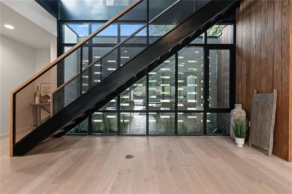 The Home in Austin, a new construction designed by Davey McEathron offers a wide open floor plan and floor-to-ceiling windows allowing for abundant natural light is now available for sale. This home located at 2104 Ann Arbor Ave, Austin, Texas