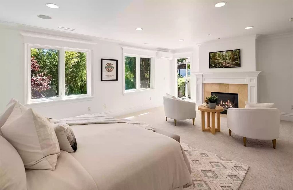 The loose sheets, white and sand-tone furnishings, and cement tile flooring give this bedroom decor an industrial edge while giving it a laid-back, beachy vibe. When combined, the hues conjure up a foggy morning by the sea.