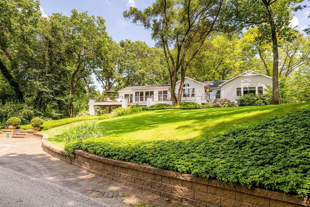 The Home in Stevensville offers privacy in a park-like setting with beautiful landscaping, rolling hills, woods and a private tennis court, now available for sale. This home located at 4661 Notre Dame Ave, Stevensville, Michigan