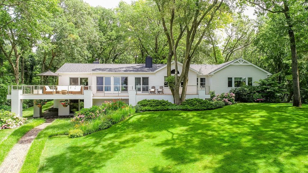 The Home in Stevensville offers privacy in a park-like setting with beautiful landscaping, rolling hills, woods and a private tennis court, now available for sale. This home located at 4661 Notre Dame Ave, Stevensville, Michigan
