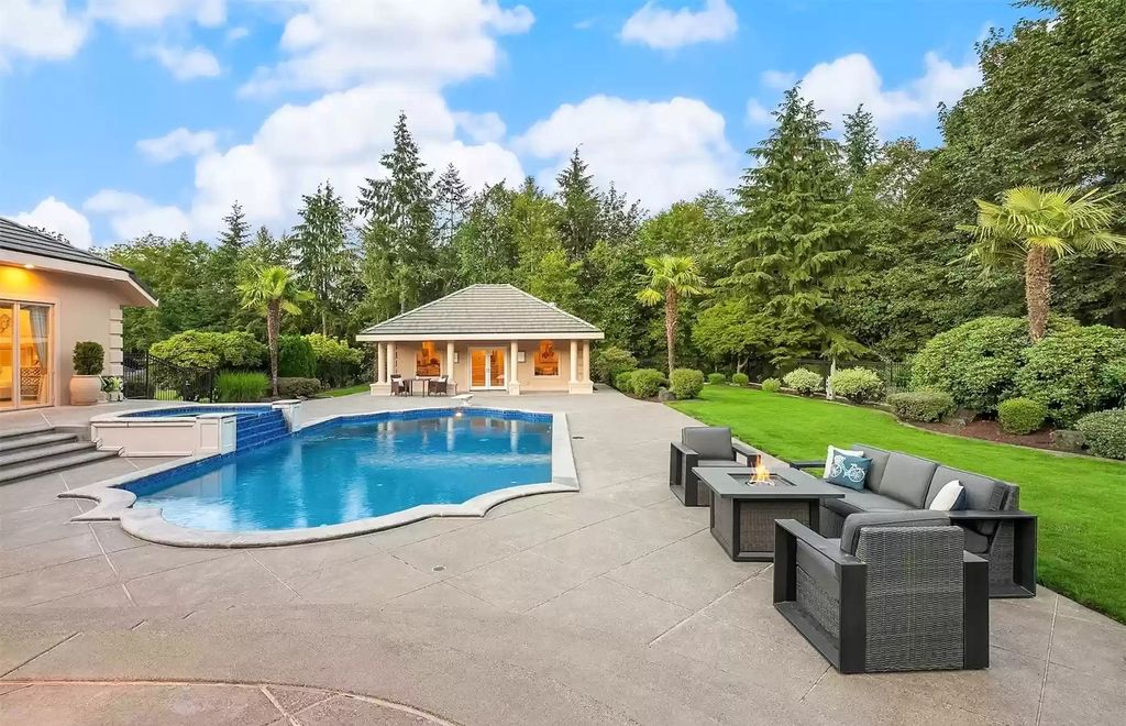 The Estate in Auburn is a luxurious home located on a tranquil setting with nature surrounding now available for sale. This home located at 20927 SE 322nd Street, Auburn, Washington; offering 04 bedrooms and 05 bathrooms with 4,610 square feet of living spaces.