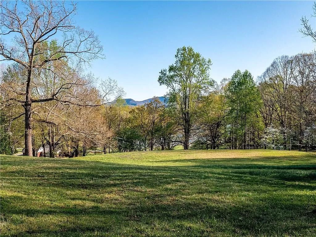 The Estate in Hiawassee is a one-of-a-kind legacy property with timeless architecture now available for sale. This home located at 1970 Hilltop Dr, Hiawassee, Georgia